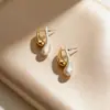 Brincos de Metal Geométricos Retrô Agulha de Prata S925 Design de Nicho Feminino Brincos de Alto Nível Luxo Acessível Brincos Atmosféricos Atacado
