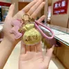 Llavero de Oro Puro 999 Creativo de Moda Colgante de Oro Bolso de Riqueza Diaria Bolsa de la Suerte Encanto Concha de Agua Mismo Estilo