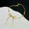 Conjunto de collar y pulsera de perlas con lazo, de lujo, accesible, de alta gama, resistente a la decoloración, de oro de 18 quilates, titanio, acero, cadena de serpiente de verano para mujer.