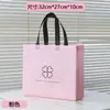 Bolsas no tejidas en stock, bolsas de mano, bolsas de regalo, bolsas pequeñas para tiendas de ropa, bolsas no tejidas, bolsas para ropa, con un toque de alta gama