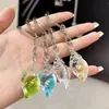 Chaveiro de Pingente de Concha Luminosa Simulada Acrílica Transparente Transfronteiriço para Casal Chaveiro Feminino Joias Atacado