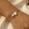 O Melhor Presente de Dia dos Namorados: uma Pulseira Artesanal Feita de Conchas Coração de Pêssego com um Design de Emenda de Pérolas Que Simboliza a Beleza