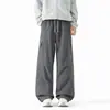 Pantalones personalizados/forrados de polar para otoño e invierno, impermeables y cortavientos, pantalones de trabajo holgados rectos de moda para hombre, estilo grueso