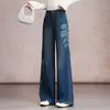Pantalones acampanados de mezclilla versátiles con estampado retro de moda para mujer, nuevos pantalones casuales de cintura alta adelgazantes para otoño 2026