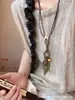 Collar de Pluma de Bronce para Mujer, Estilo Étnico Bohemio, Diseño Largo de Doble Capa, Accesorio de Alta Gama con un Toque de Nicho y Sofisticado