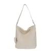 Bolso tejido de alta gama vintage para mujer, nuevo bolso de hombro de moda 2026 para ir al trabajo, bolso de cubo de mano de gran capacidad
