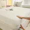 2026 Nueva Clase A Color Sólido Sensación de Nube Kapok Arrugado Doble Capa Gasa Sábana Ajustable Pieza Única Colchoneta de Cama Cubrecama Protector