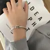Pulseira Aberta Europeia e Americana de Prata Tailandesa com Nó Romano Desgastado Levemente Luxuosa de Alta Qualidade Torcida Hip-Hop Pulseira com Sino