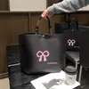 Bolso de mano para mujer de gran capacidad con logo impreso, tienda de ropa de alta gama, bolsa de regalo verde para compras, lazo, venta al por mayor