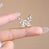 Broche de mariposa hueco con diamantes brillantes, pasador de seguridad anti-luz, decoración fija para cárdigan, bufanda