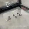 Aretes de Hueso de Oreja de Tornillo de Perla Flor de Iris Diseño de Nicho Femenino Sentido de Diseño Exquisitos de Moda Elegantes para el Cartílago