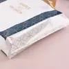 Bolsa de compras pequeña de plástico para ropa fresca de hombre y mujer, bolsa de mano para cosméticos, regalo, bolsa de plástico pe impresa de mano