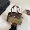 Nova bolsa Kelly para atacado em live-stream transfronteiriço, bolsa transversal versátil de alta moda para o trabalho, bolsa com fecho prateado