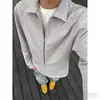 Camisa polo de imitación de dos piezas de color liso minimalista estilo americano para el otoño de 2026, top de manga larga con media cremallera de alta gama para hombre