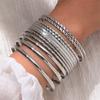 Pulsera ancha exagerada de personalidad retro transfronteriza de Europa y Estados Unidos, traje, pulsera irregular lisa dorada, juego de pulseras de varias piezas