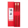 Palillos de cobre de metal estilo chino con cabeza cuadrada, doble felicidad, sándalo rojo, alitas de pollo, palillos de madera de ébano, vajilla de regalo para hotel y hogar.