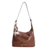 Bolso de Axila Texturizado de Diseño de Nicho para Mujer 2025 Nuevo Versátil Estilo Coreano Color Puro Bolso de Hombro Cruzado de Viaje de Gama Alta