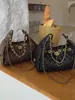 Bolsa Pequena Estilo Francês da Moda Feminina 2026 Nova Bolsa Saco de Balde High-End para o Dia a Dia Corrente Acolchoada Bolsa de Ombro Único para o Braço
