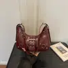Bolsa de motocicleta feminina 2026 nova moda bolsa bolinho versátil bolsa de axila bolsa de trajeto bolsa crescente bolsa de ombro transversal texturizada