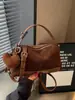 Bolso de mano único y discreto de lujo para mujer, nuevo modelo 2026, lindo y versátil, bolso de hombro y cruzado vintage de otoño para el trabajo