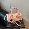 Bolsa de Mão de Moda Transfronteiriça com Laço Design Cilíndrico para Mulheres, Novo Estilo Verão 2026, Pingente de Espelho Personalizado, Bolsa de Ombro Único Transversal
