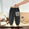 Versión Coreana 2026 Pantalones Jogger Cálidos Forrados de Felpa para Otoño e Invierno de Niños Pantalones Elásticos Pantalones Deportivos de Moda para Bebés y Niños Pequeños