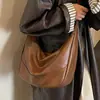 Bolsa retrô moderna de grande capacidade para mulheres, nova moda de nicho para o dia a dia, bolsa tipo bolinho, bolsa de ombro e transversal para comércio exterior