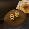Pendiente de botón ovalado de lujo de alta gama con apertura y cierre de girasol para mujer, compacto, de temperamento, moda, nicho para ir al trabajo, joyería al por mayor