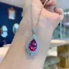 Anillo de corindón rojo de simulación Pendientes colgante collar de moda popular europea y americana Juego de pendientes de corindón rojo de imitación