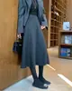 Saia midi de lã cinza super bonita feminina outono 2026 inverno nova cintura alta linha A barra larga saia de lã acetato