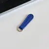 [en stock al por mayor] Carcasa de cuero para teléfono móvil, accesorios de joyería, colgante multicolor, hebilla de cremallera para equipaje, tirador de color sólido