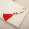 6CM trébol de cuatro hojas borla fuzi borla marcapáginas oreja colgante colgante de joyería caja de regalo accesorios colgantes grandes precio excelente