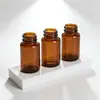 Garrafas de vidro marrons personalizadas de boca larga de uma fábrica de vidraria farmacêutica, frascos de armazenamento de 75-200ml para produtos de saúde e pós, frascos medicinais à prova de luz