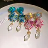 Brincos de agulha de prata com pingentes de gota d'água floral com aplicação de óleo e cravejados de diamantes, brincos de estilo infantil fresco e doce, brincos com sensação de luxo leve e de alta qualidade