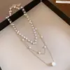 Collar colgante de múltiples capas con cuentas de perlas estilo francés, simple y moderno, adecuado para ir al trabajo, cadena para la clavícula, sensación de lujo ligero y alta gama, accesorio para mujer