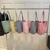 Bolso de mano informal de lona a rayas de doble cara, estilo perezoso, de gran capacidad, 2025