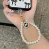Nuevo Colgante Creativo de Llavero de Aleación para Coche con Perlas Oso Corazón Accesorios Colgantes para Bolsos Caja de Auriculares