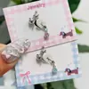 Brincos de Gatinho Fofos Feitos de Aço Titânio, Estilo Kawaii, Versáteis, Frescos e Doces, com um Pequeno Laço na Orelha de Gatinho