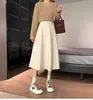 Falda nueva de estilo francés para otoño e invierno 2025, de longitud media, cintura alta, adelgazante, línea A, en color negro, falda de paraguas con dobladillo ancho para chicas menudas
