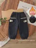 Pantalones de cuadros gruesos forrados de forro polar para niños, estilo nuevo de otoño e invierno, pantalones cálidos de algodón para niños, pantalones tipo harén con puños para bebé, pantalones largos de exterior
