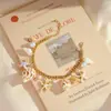 Nuevo brazalete de aleación con perlas, conchas, estrellas de mar y caracolas, estilo bohemio europeo y americano, para playa, brazalete de nicho
