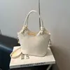 Bolso de Mano Estilo Coreano para Viaje al Trabajo para Mujeres 2026 Nuevo Modelo de Verano de Gama Alta de Nicho Bolso Cubo Versátil de Hombro