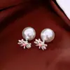 Pendientes de borla con flor de trébol de circonita vintage con un toque de alta gama, pendientes versátiles y de moda al por mayor