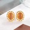Pendientes ovalados de perla con piedra de ojo de gato estilo retro francés, 2024, nuevas explosiones, estilo extranjero, diseño de nicho, pendientes de alta calidad.
