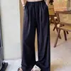 Pantalones de pierna ancha de color liso con cordón y bolsillos de seda helada, estilo nuevo de verano para mujer, pantalones casuales estilo perezoso, pantalones holgados hasta el suelo, transfronterizo