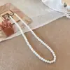 Collar de perlas con hebilla de lingote de sentido de alta gama para minoría francesa Ni Ni, accesorios para mujer, venta al por mayor de fábrica de origen de Yiwu
