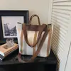 Bolsa de Grande Capacidade para o Dia a Dia para Mulheres 2026 Inverno Nova Bolsa de Lona Listrada Bolsa Tote de Ombro Casual Bolsa de Mão