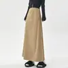 Foto real de la falda de gamuza de estilo coreano para otoño e invierno 2026, de cintura alta, que cubre la cadera, adelgazante, hasta la rodilla, de longitud media, con un dobladillo grande