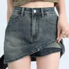 Nova saia jeans A-line retrô de cintura alta elástica afunilada estilo americano para mulheres, anti-exposição, minissaia jeans que abraça o quadril para uso externo