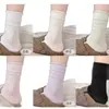 Calcetines de algodón suaves para primavera y otoño, sin costuras, de color liso, con borde enrollado, antipelusas, versátiles, de moda, de media pantorrilla, con un aspecto de alta gama y un diseño de volantes